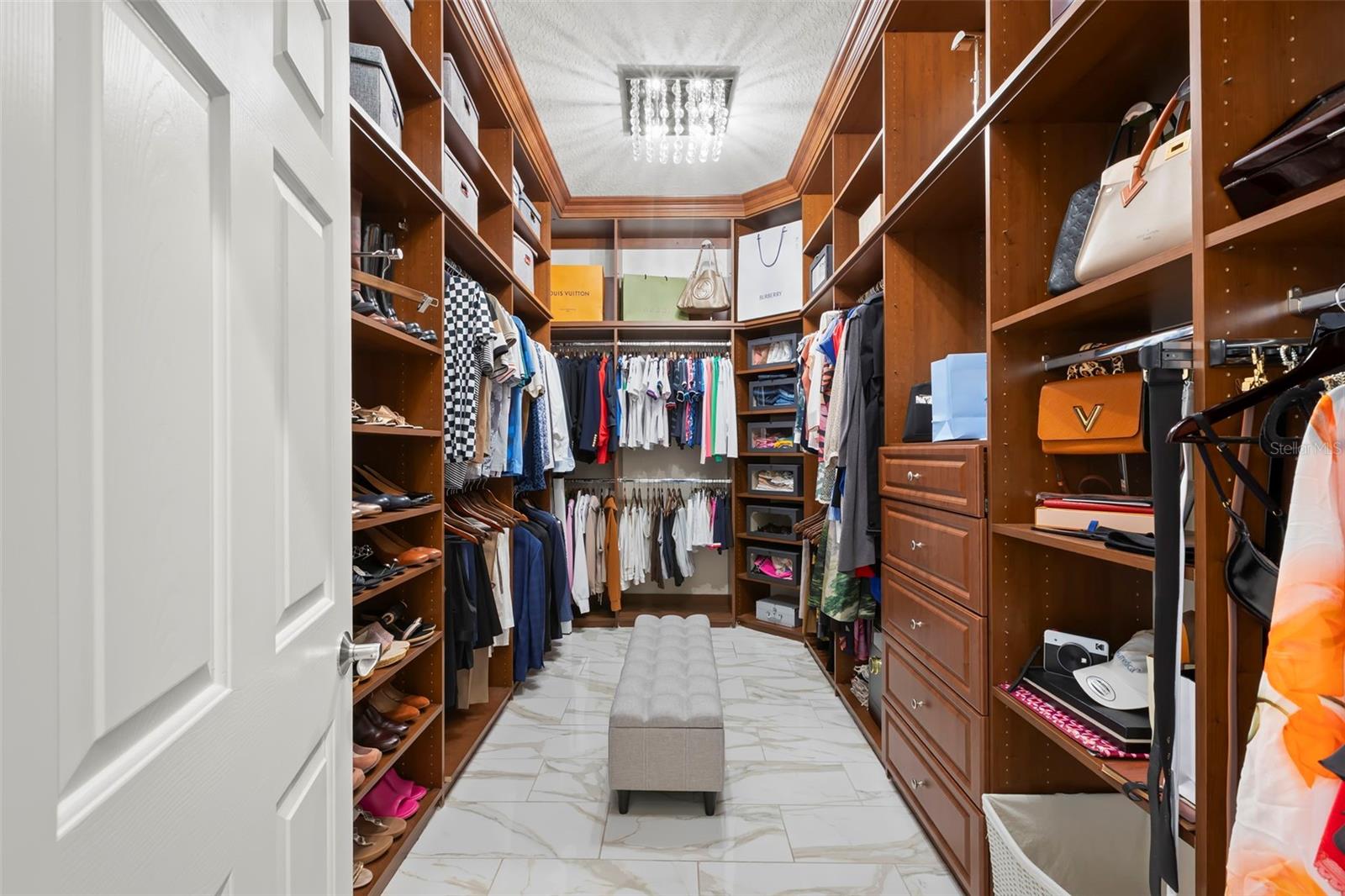 Oversized custom closet in primary bedroom.