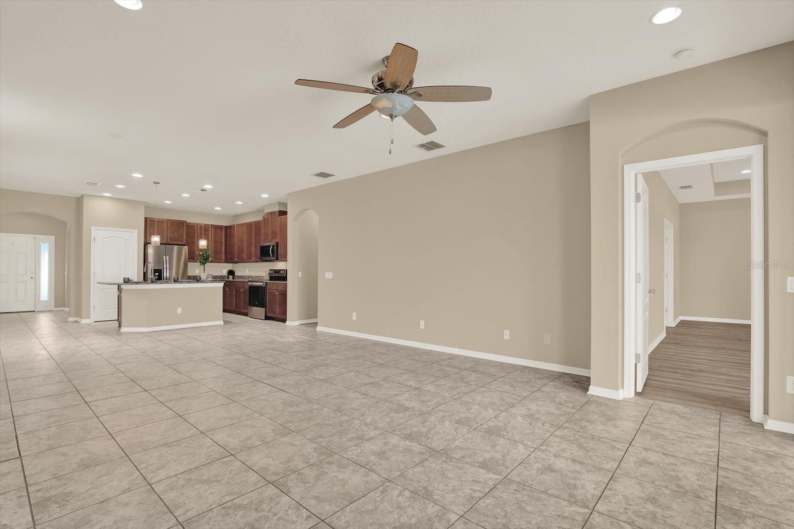 Living/Dining area view to Kitchen & Primary Bedroom