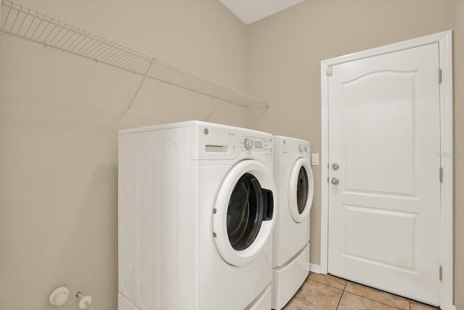 Laundry room with entry to garage