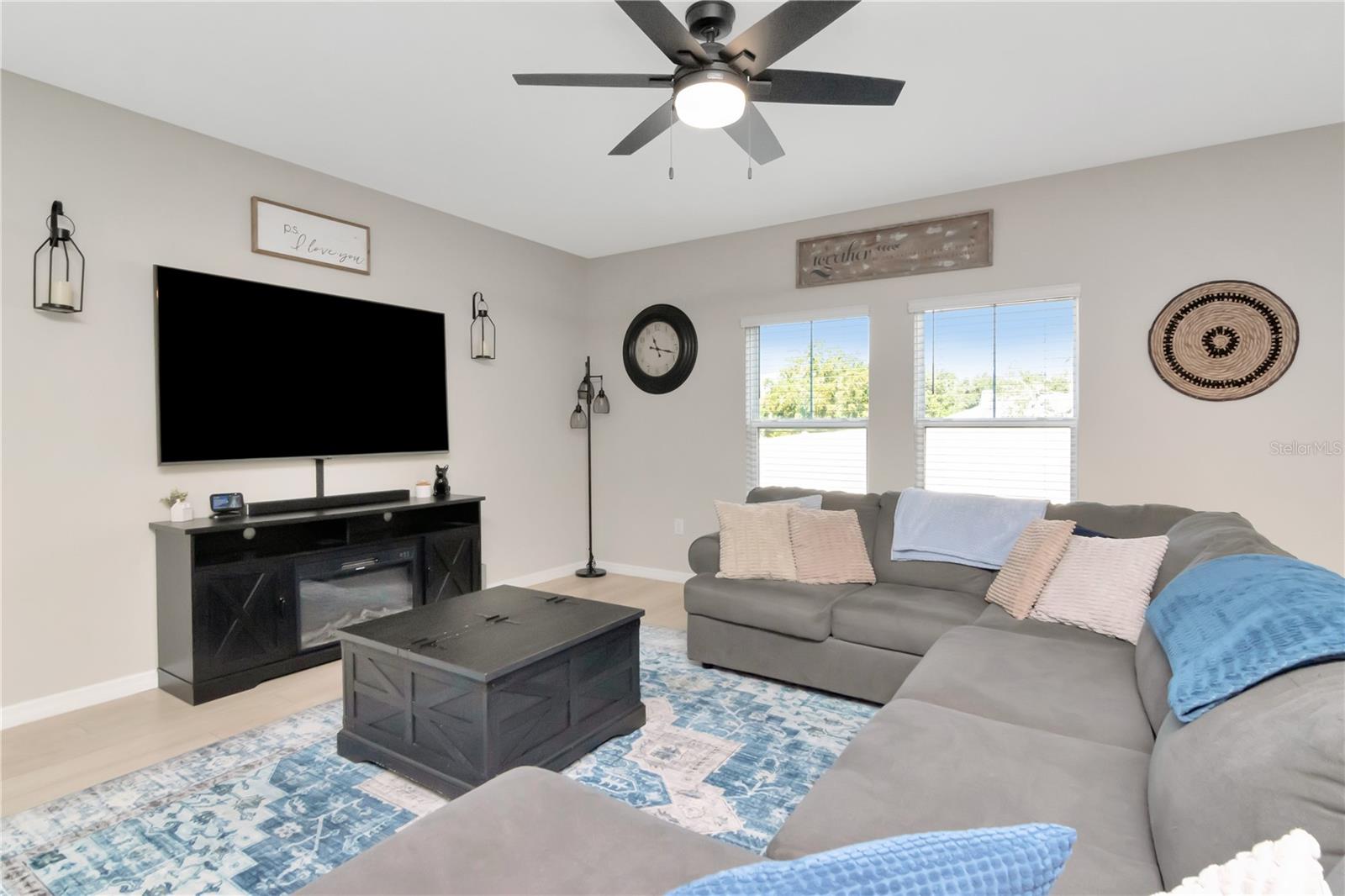 Living Room with Windows and Upgraded Ceiling Fan