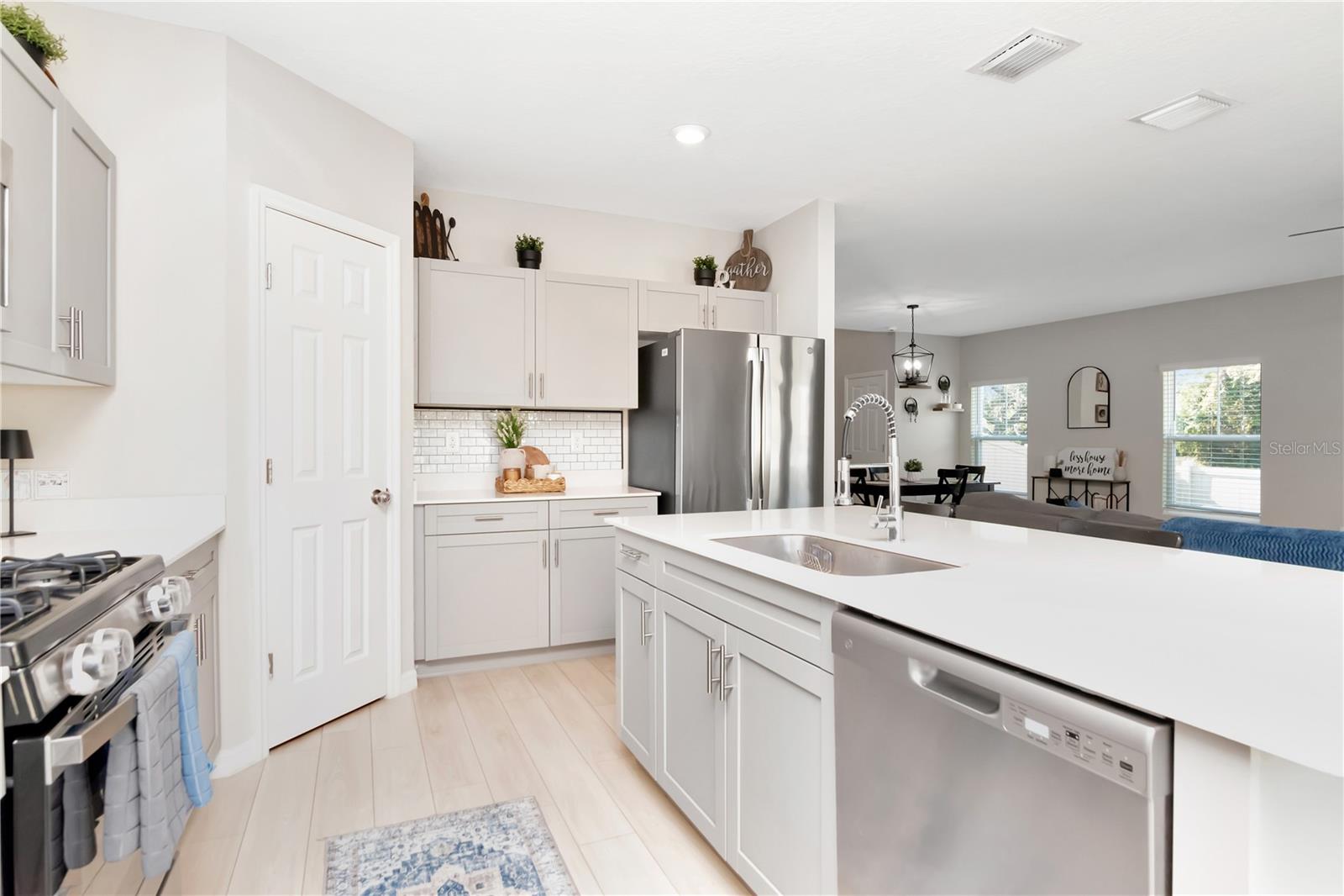 Kitchen with upgraded hardware, fixtures and soft close cabinets.