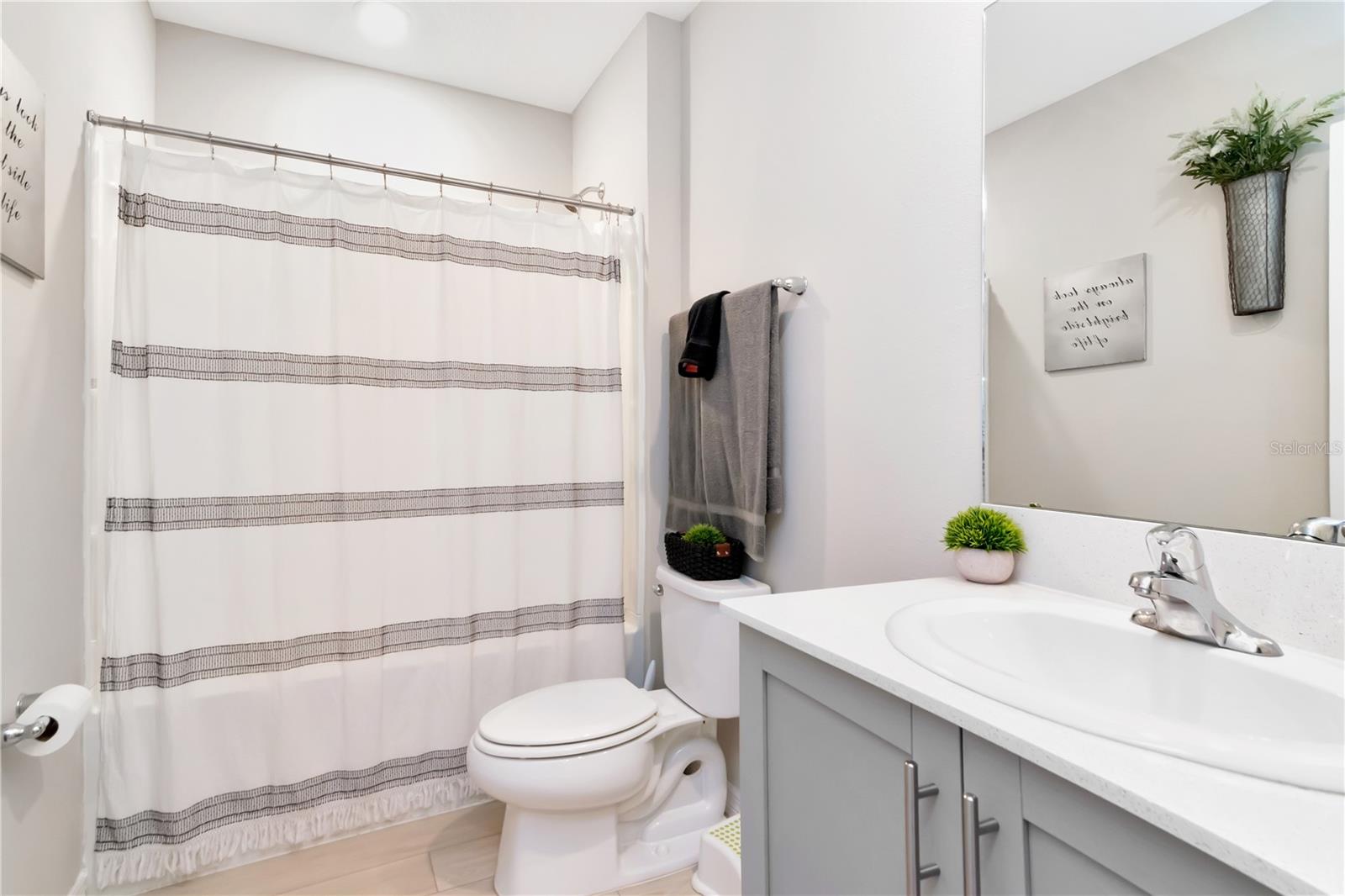 Full Bathroom with Tub/Shower and Soft close cabinets next to Guest Room