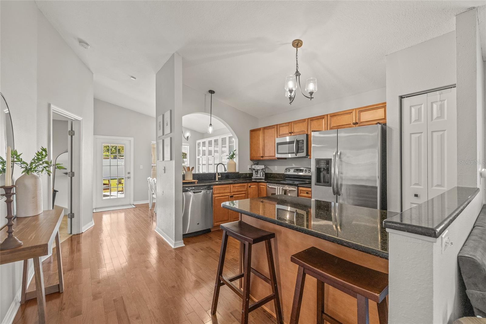 Breakfast bar for casual seating with a dining room in the rear of the home.