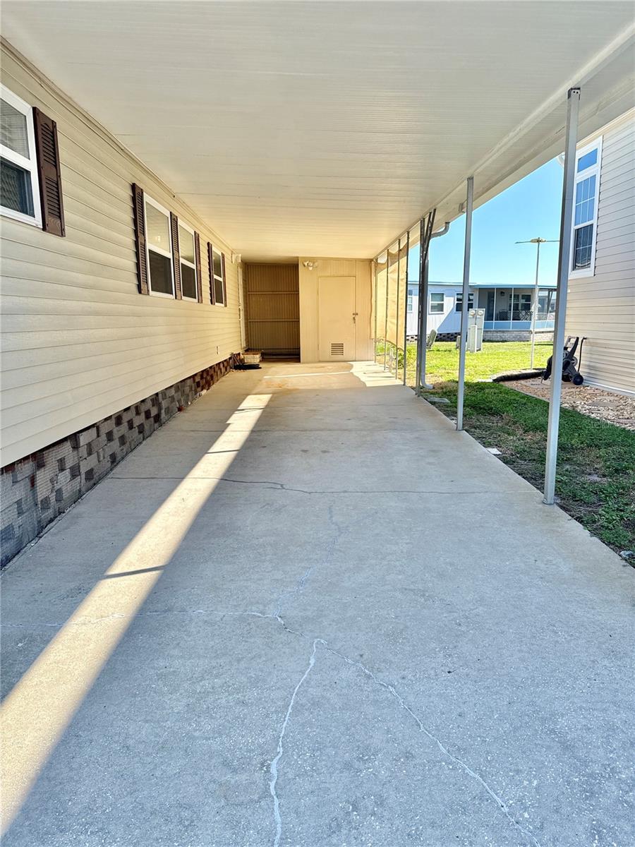 Long carport holds multiple vehicles