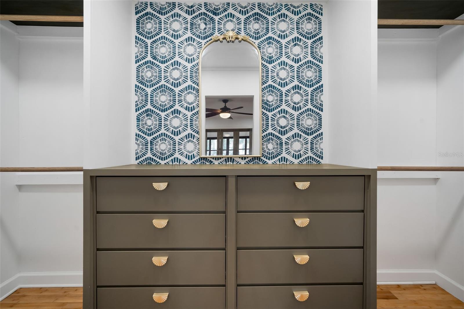 walk in closet with custom built ins in second bedroom