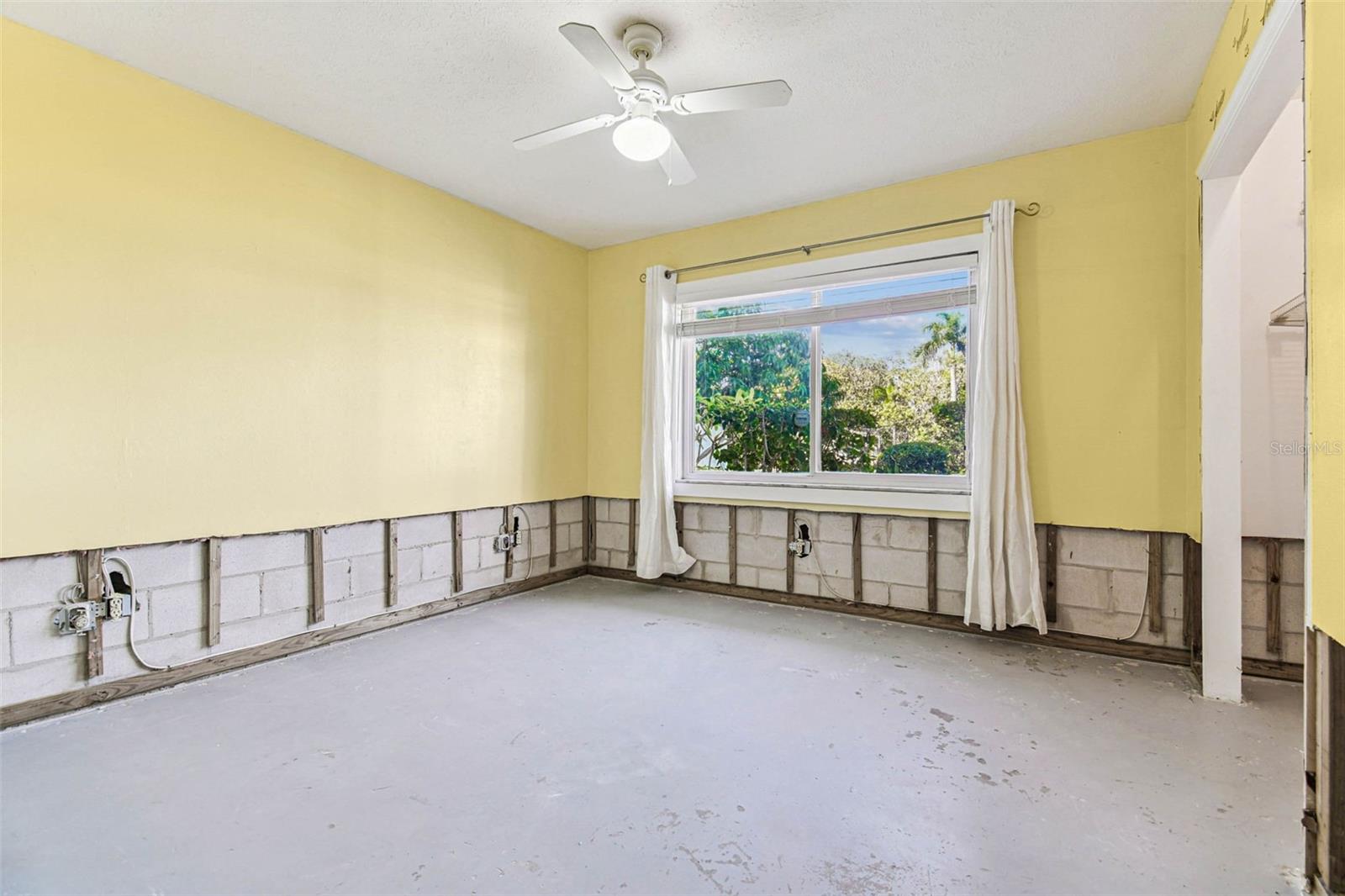 2nd Bedroom with view of the outdoor patio and canal