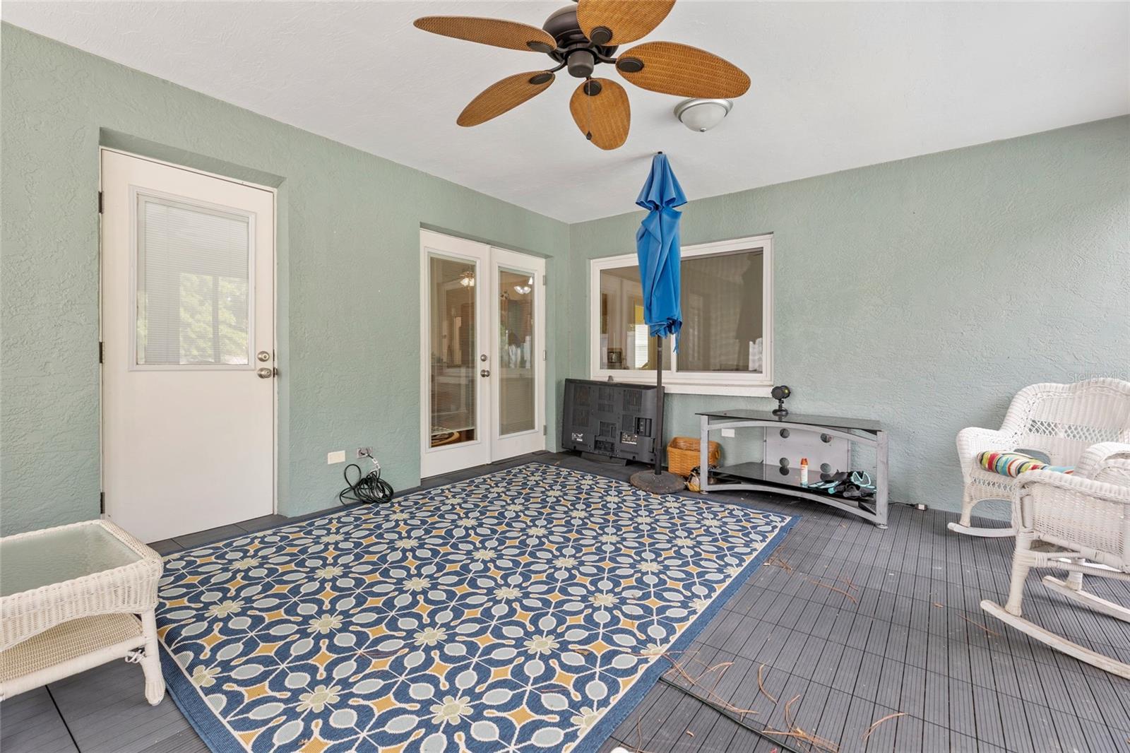 The door on the left opens to the ensuite bathroom in the primary bedroom. The other doors open to the dining area.