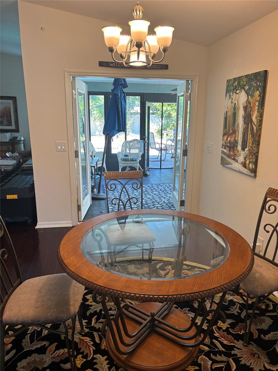Doors open to the porch via the dining area.