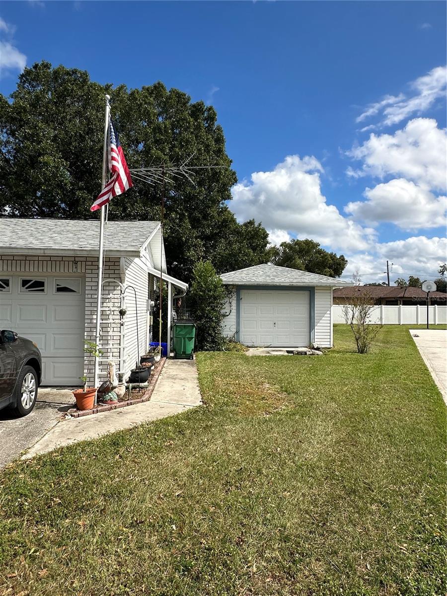 Side of Home with outbuilding