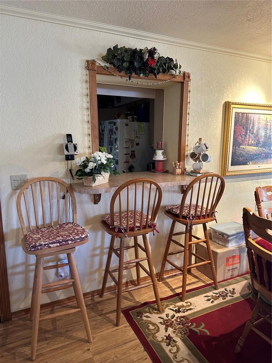 Pass through window to kitchen with bar stools