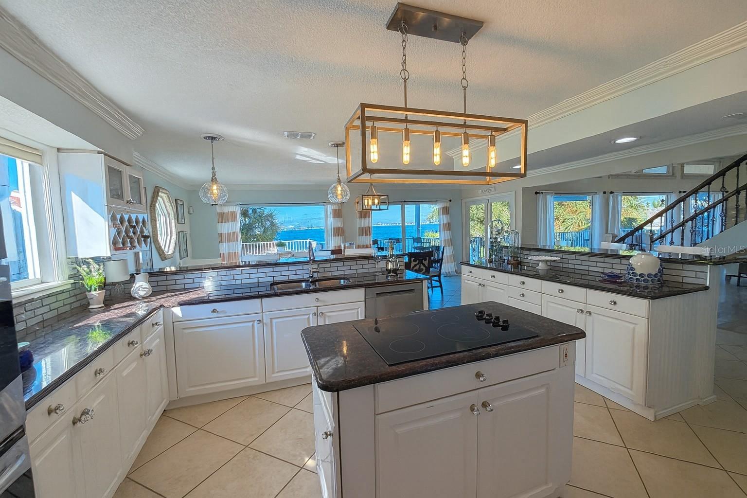 all-to-wall glass sliders open to the expansive waterfront balcony.