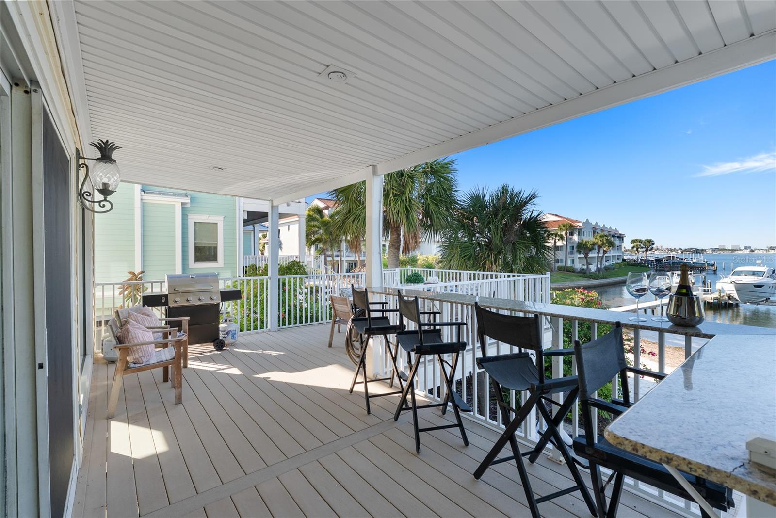 outdoor dining area with grill — ready for sunset dinners  Kitchen flows seamlessly to dining and outdoor entertaining areas