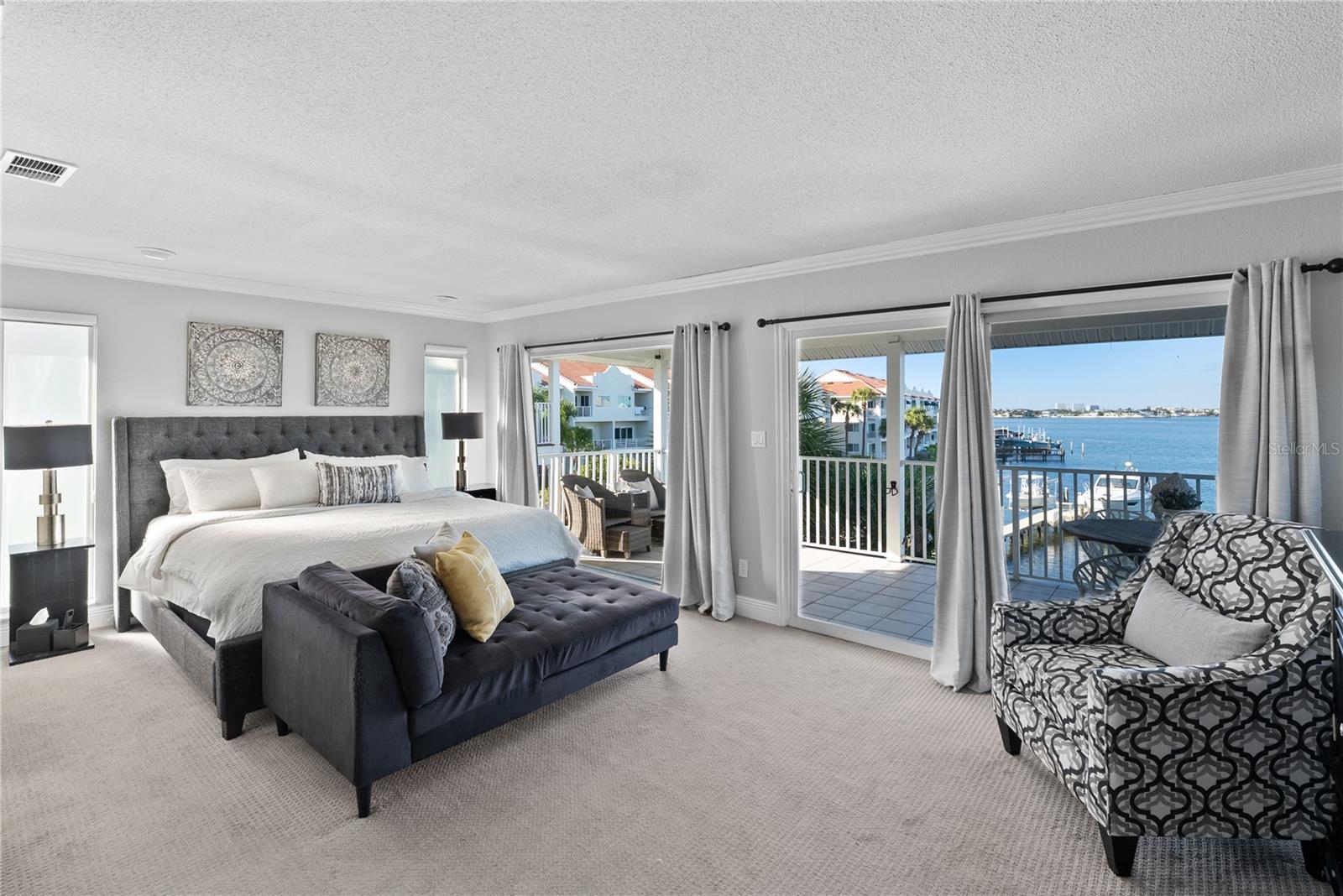 Primary suite retreat with private waterfront balcony