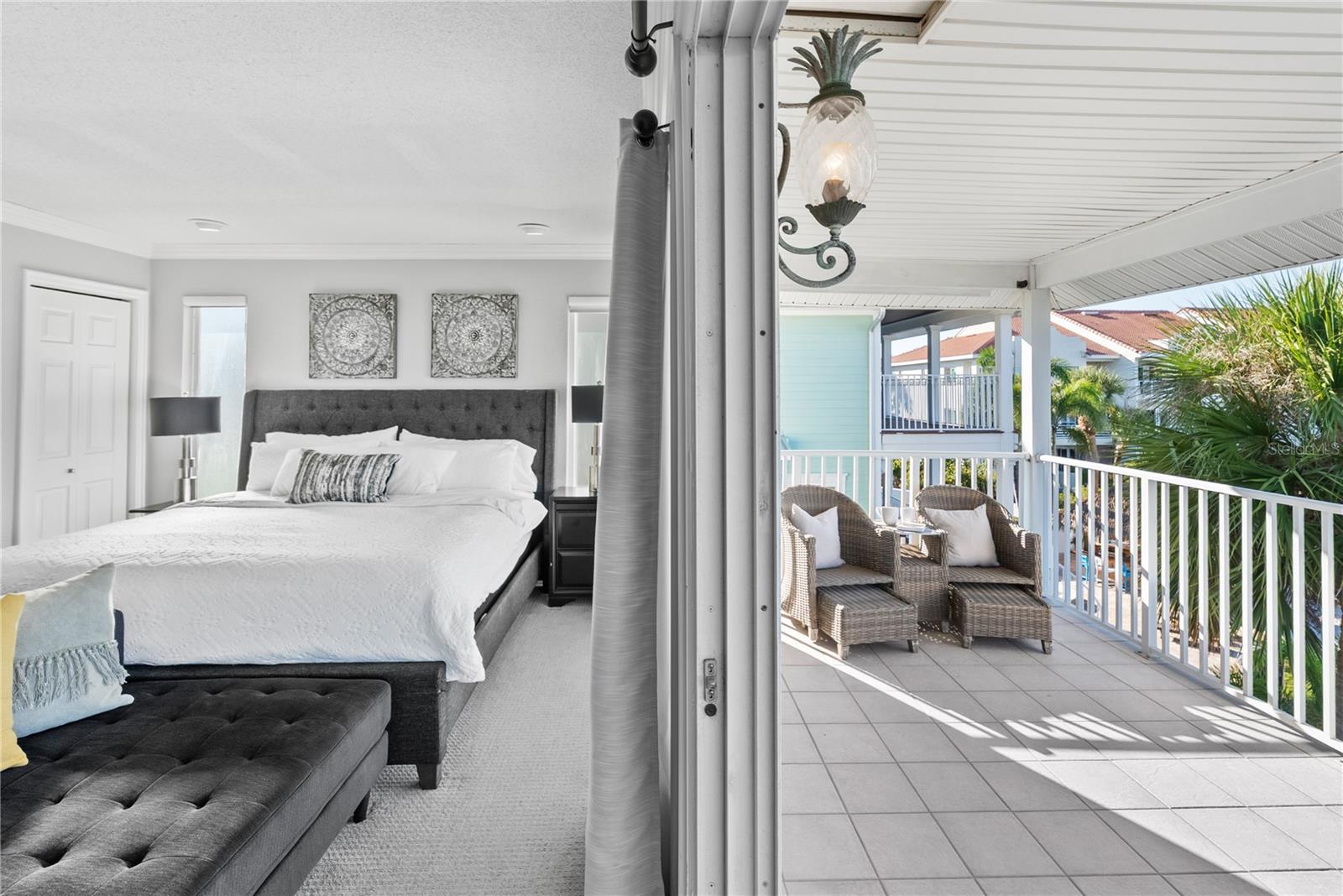 Primary suite retreat with private waterfront balcony