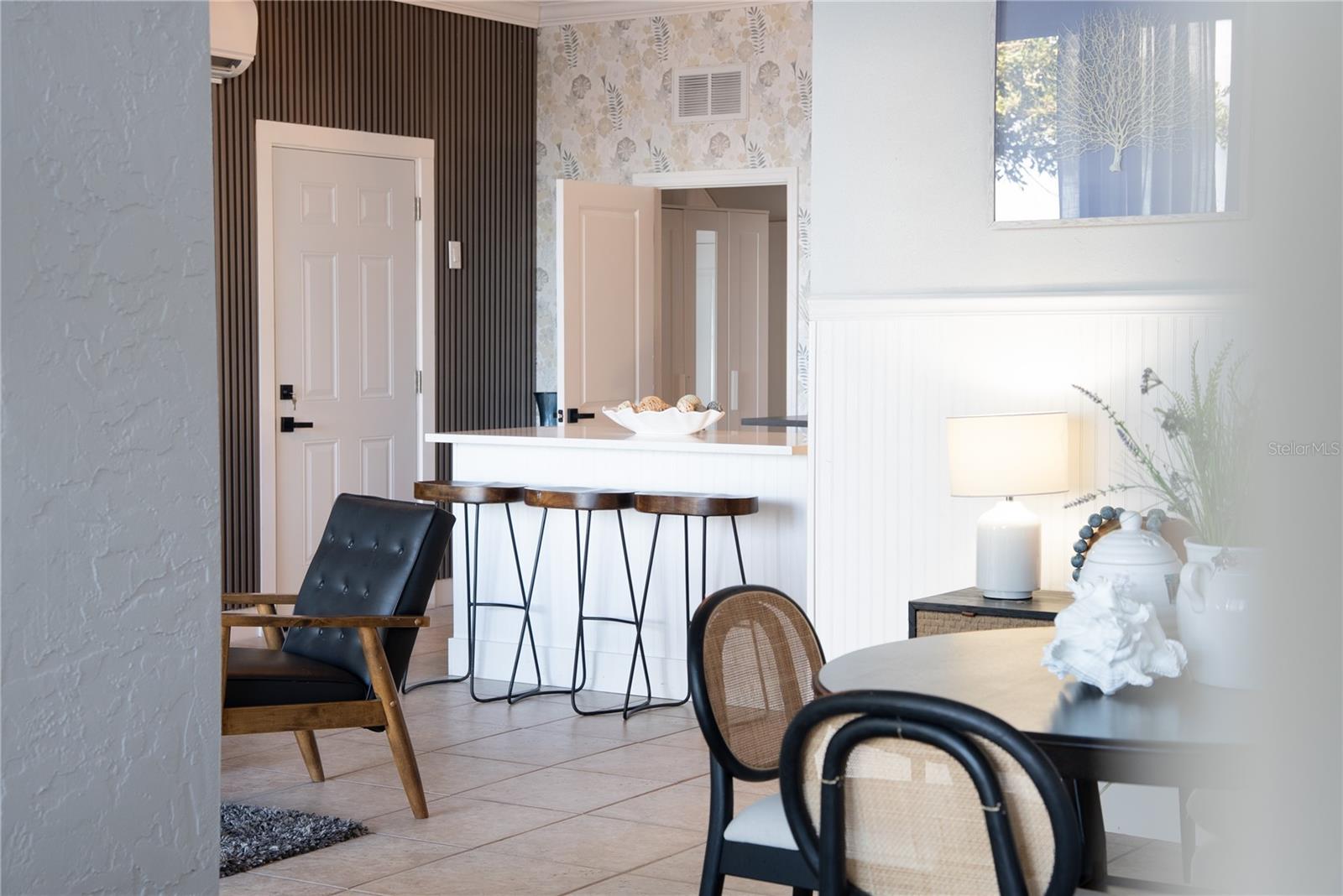 Lower-level living area with direct access to the pool and beach