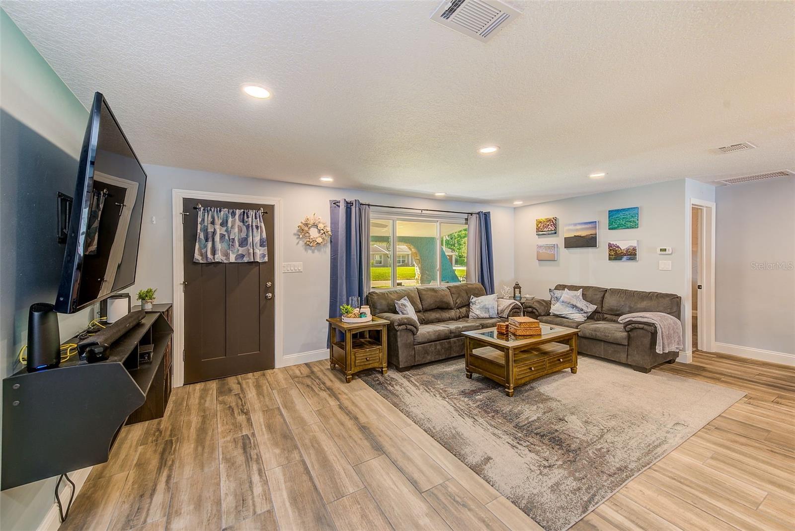 Living room with porcelain floors for easy maintenance