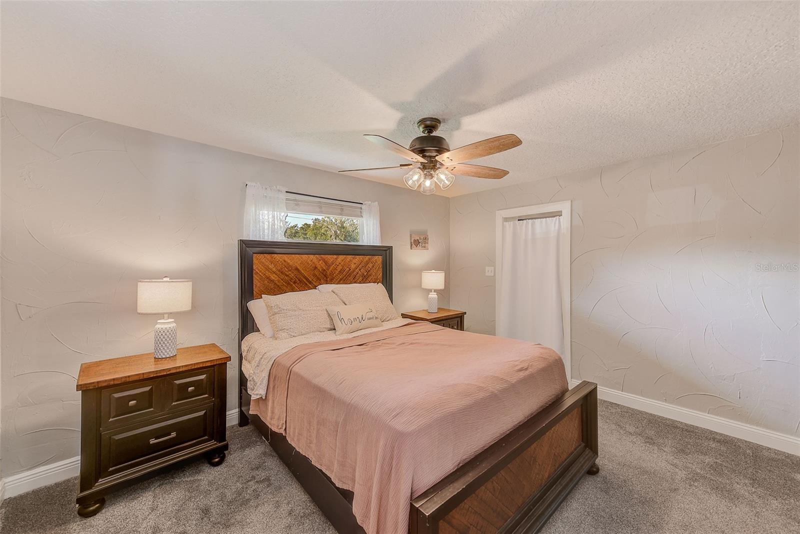 Owners suite wtih newer carpet and ceiling fam