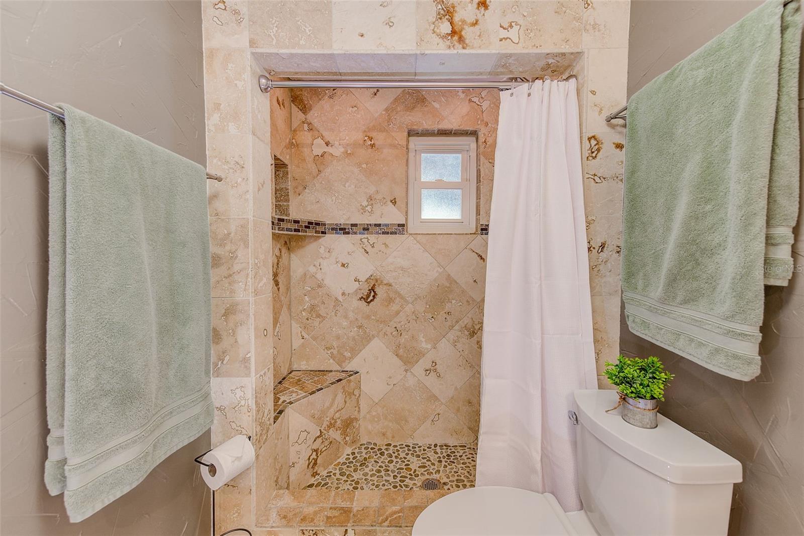 Shower with built in seat and cut custom cut outs for shower needs