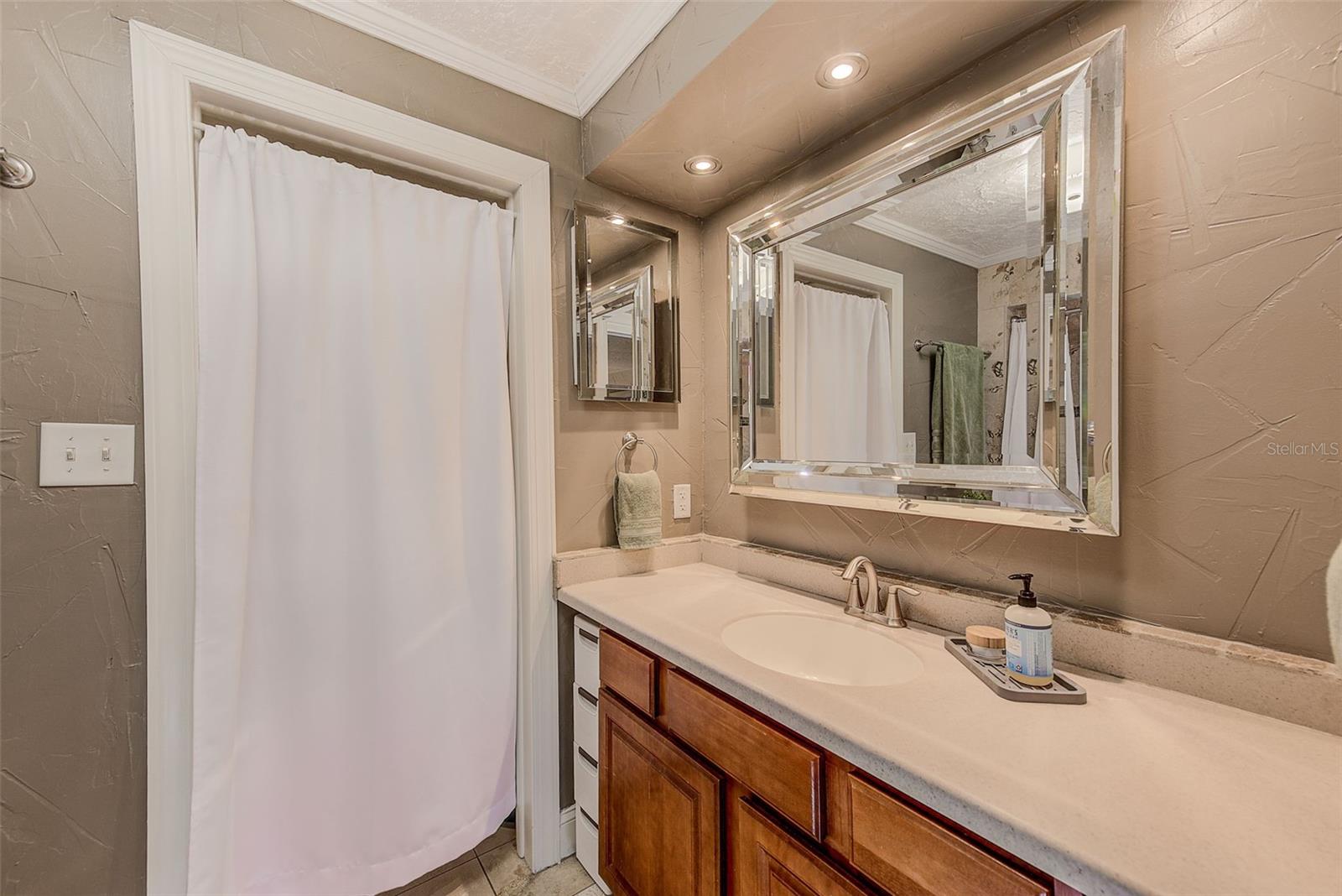 Lots of recess lighting and close by laundry room.  No need to walk across the house with wet towels and dirty clothes.