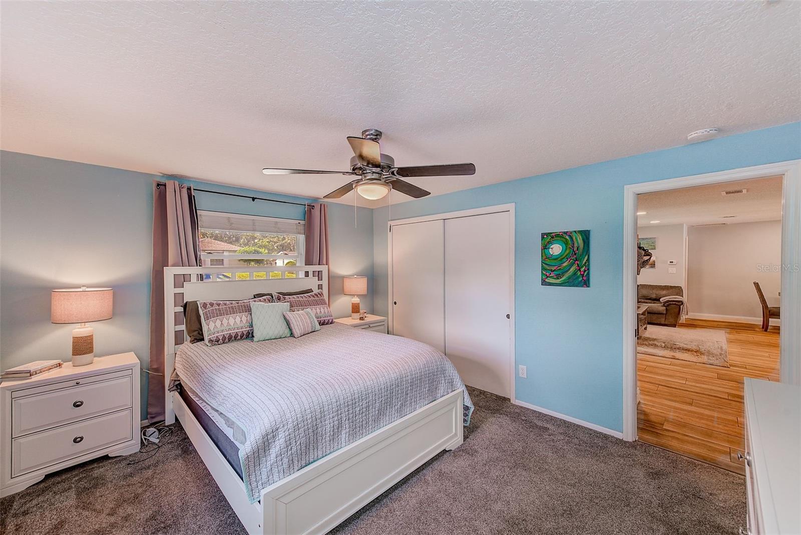 Bedroom 2 with newer carpet and ceiling fan