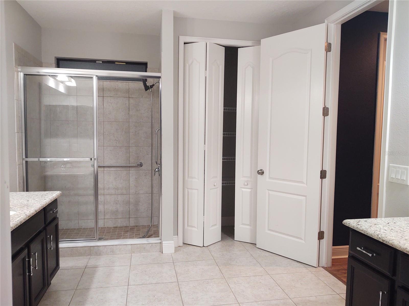 Primary Bath #4 View to Shower + Linen Closet