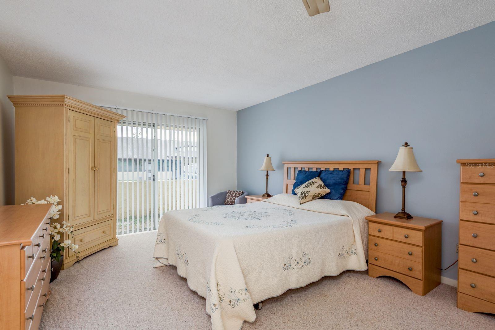 Primary Bedroom with slider to the front patio.