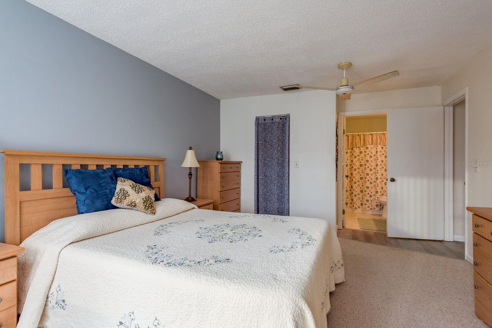 Walk in closet and primary bathroom