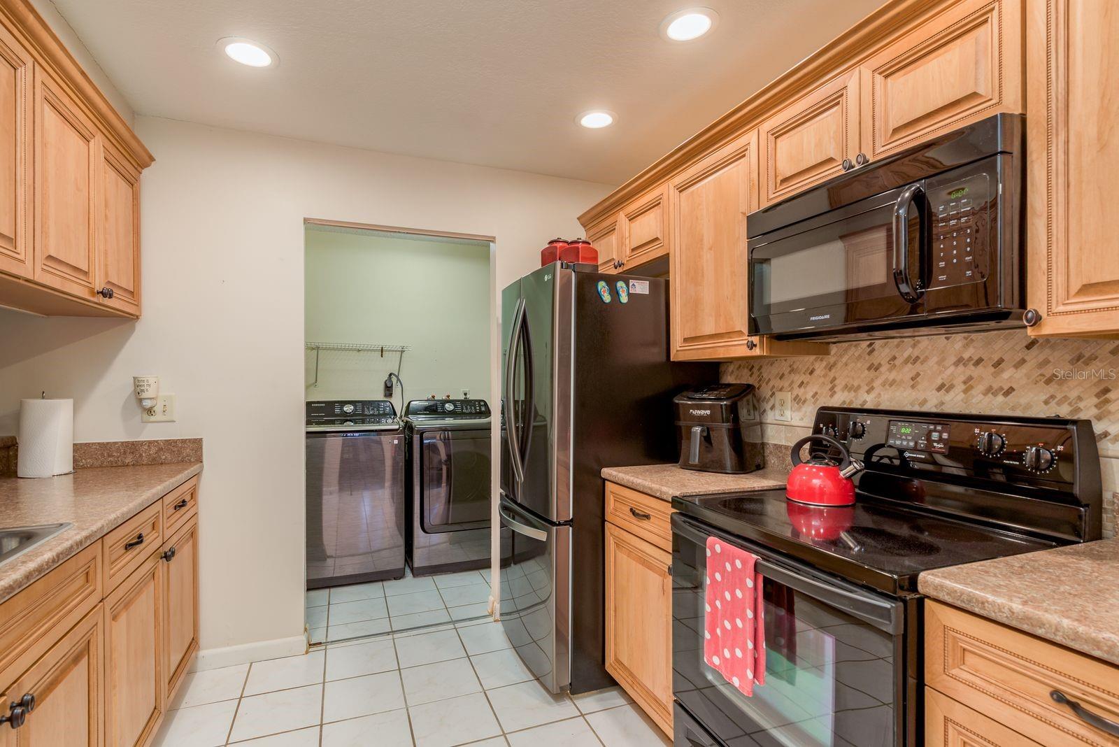 Galley Kitchen with recessed lighting.