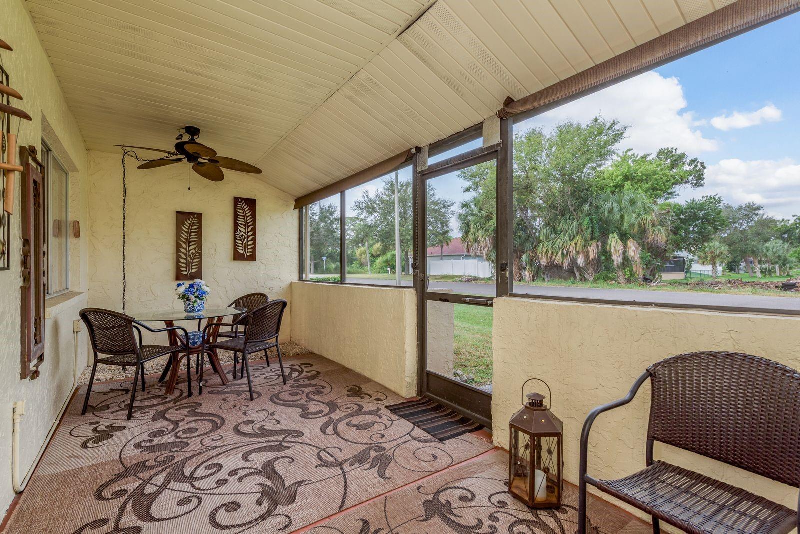 Covered lanai with access to the back of the condo.