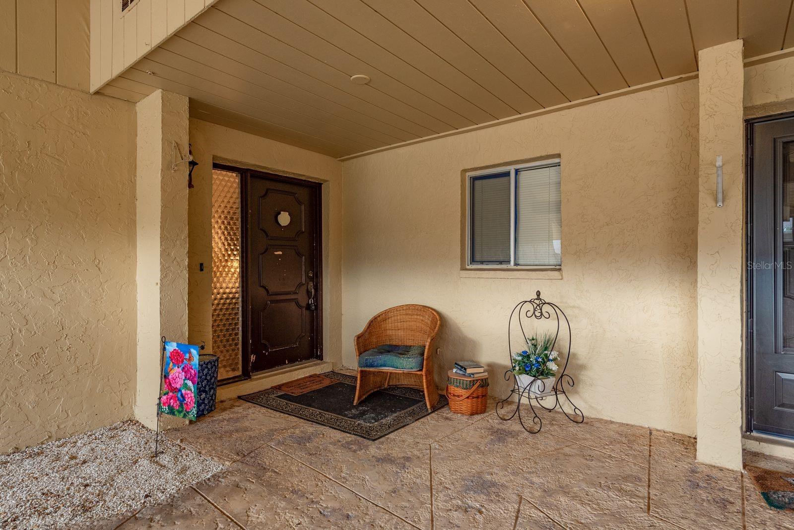 Front entrance with outside sitting area!