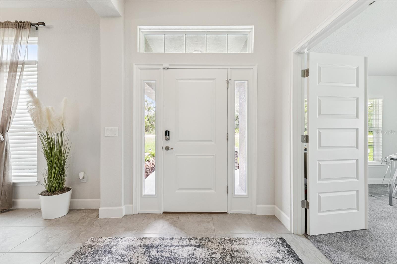 Front entrance with views of a majority of the common area.