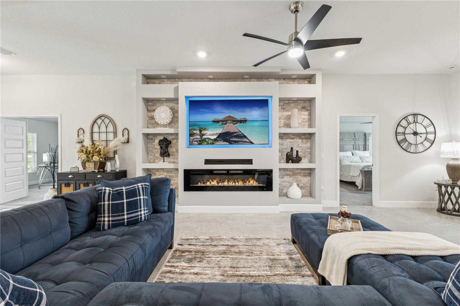 Host large gatherings in this living room equipped with a custom built entertainment system