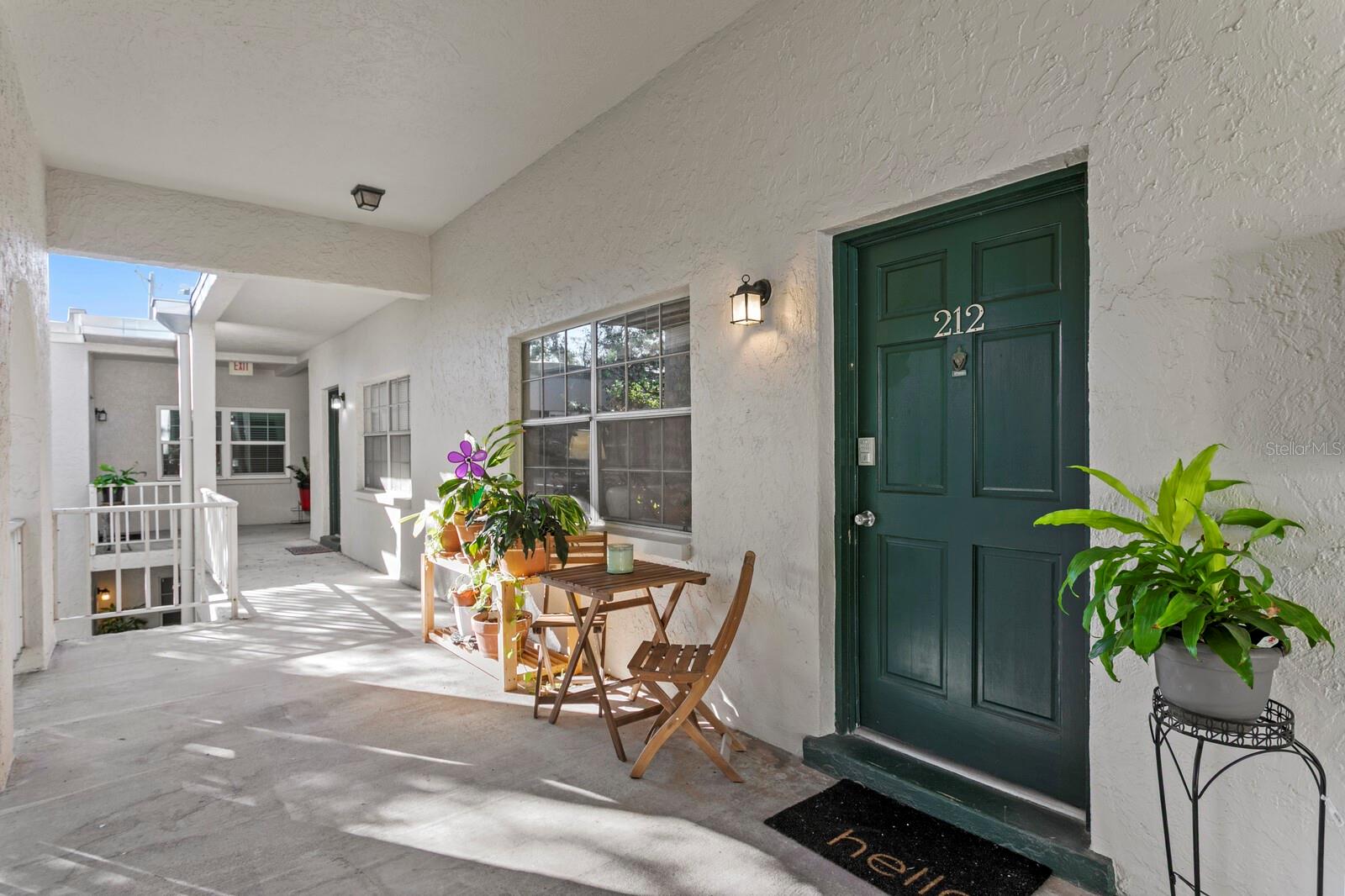 Dreamy spot outside your door, over looking the peaceful, lush landscaping.
