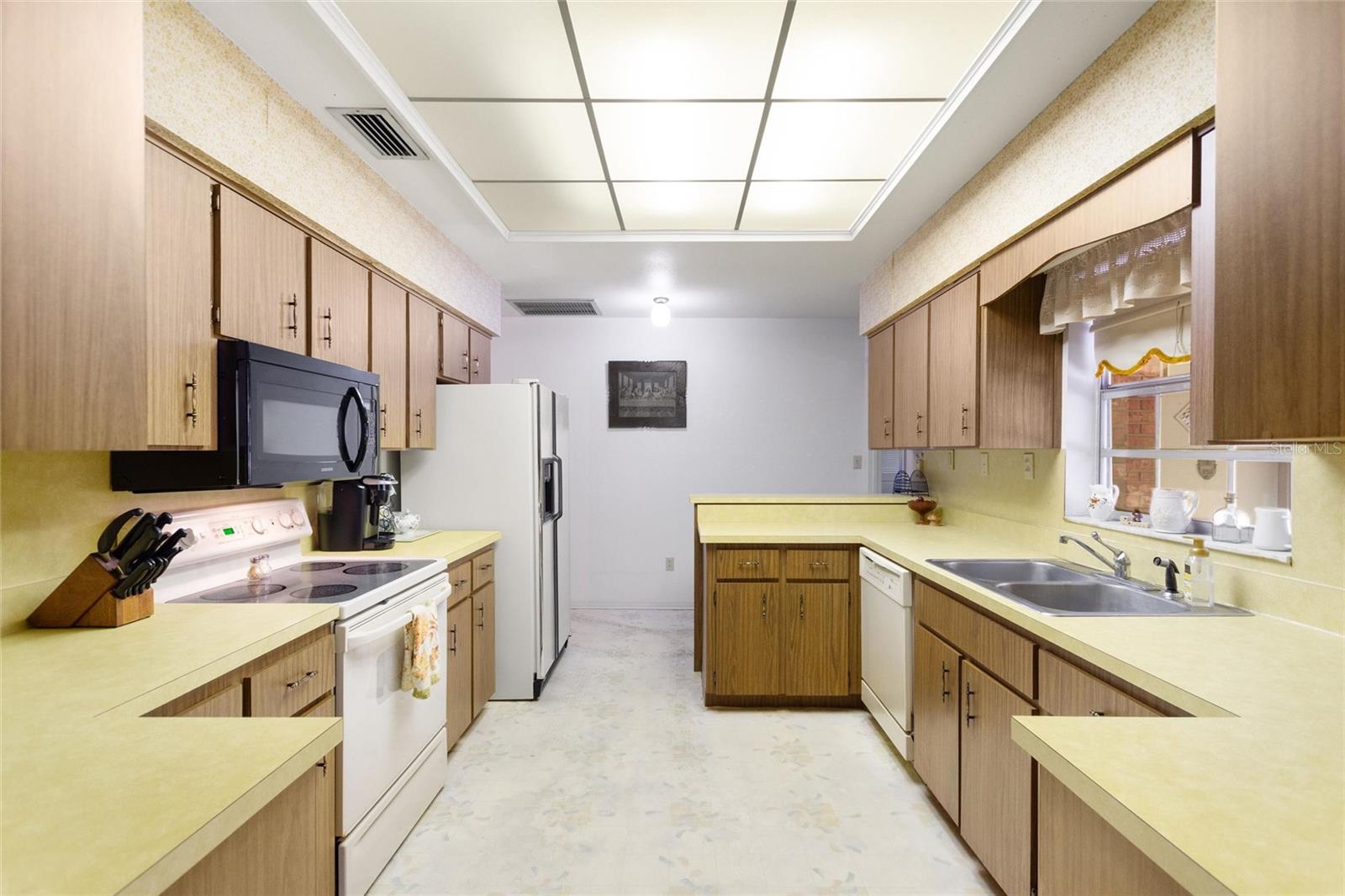 Kitchen is light and bright and has more than ample counter and cabinet space.