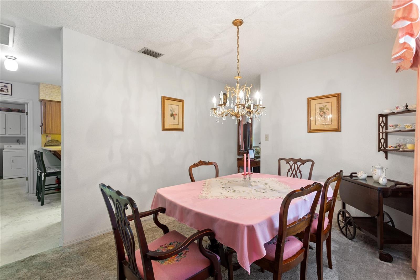 Reverse view of dining room looking into the kitchen