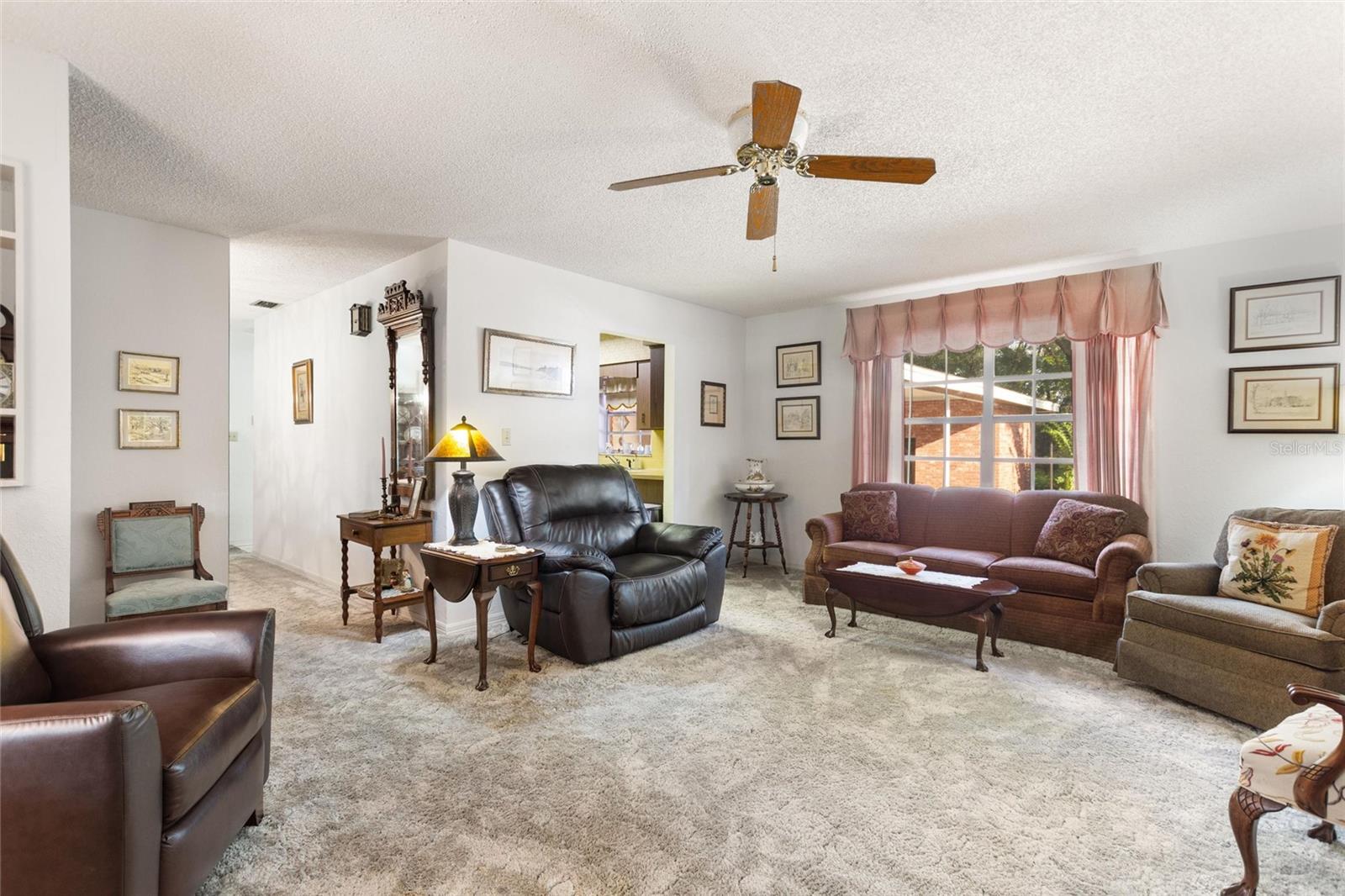Reverse view of living room.  Hallway to left goes to dining room and doorway to right leads into the kitchen.