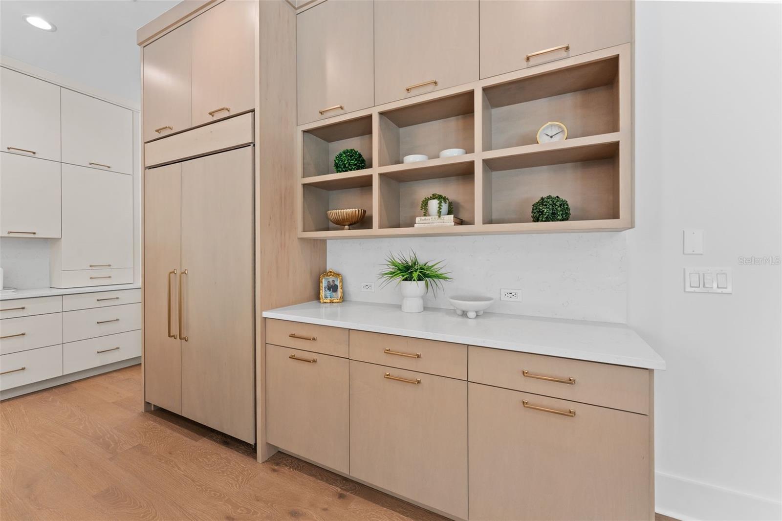 Chef's kitchen, panel ready refrigerator, built in shelving.
