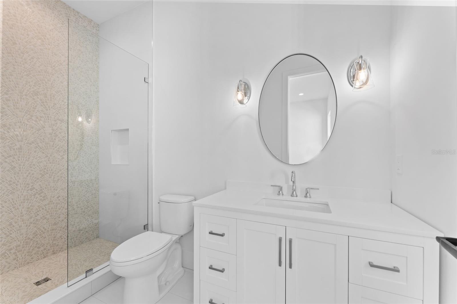 Upstairs guest bathroom 1.