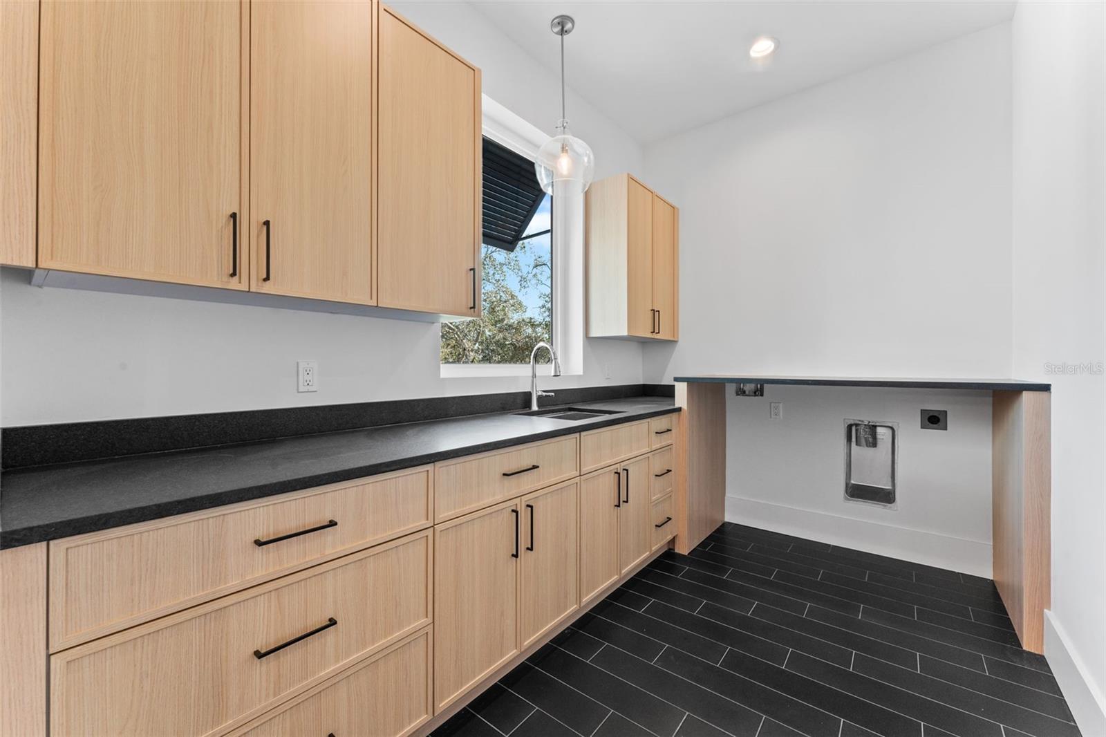 Upstairs laundry room.