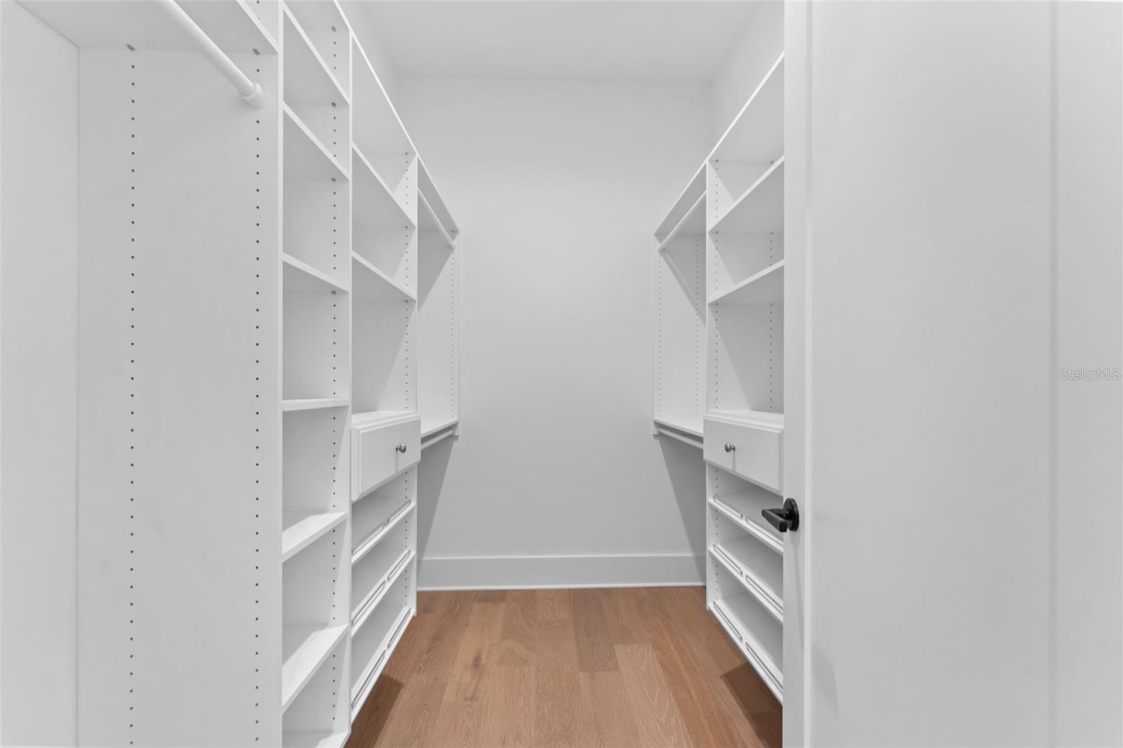 Downstairs primary walk in closet.