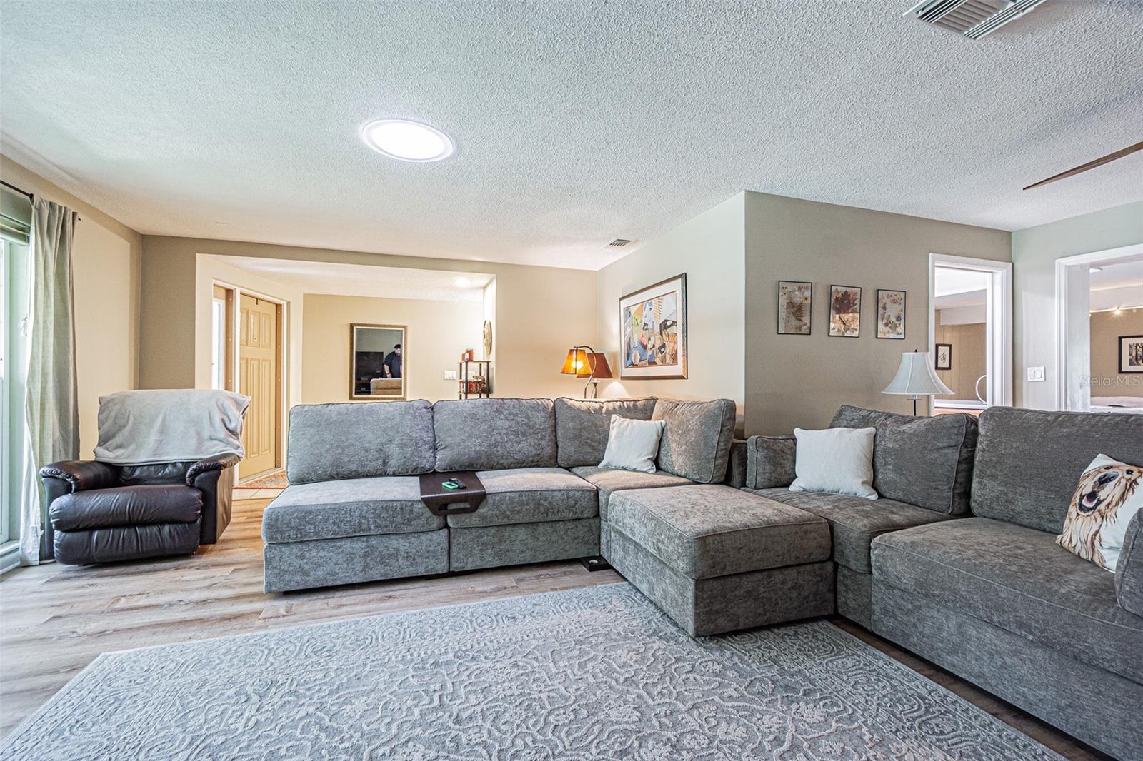 Front door and foyer to the left and living room.