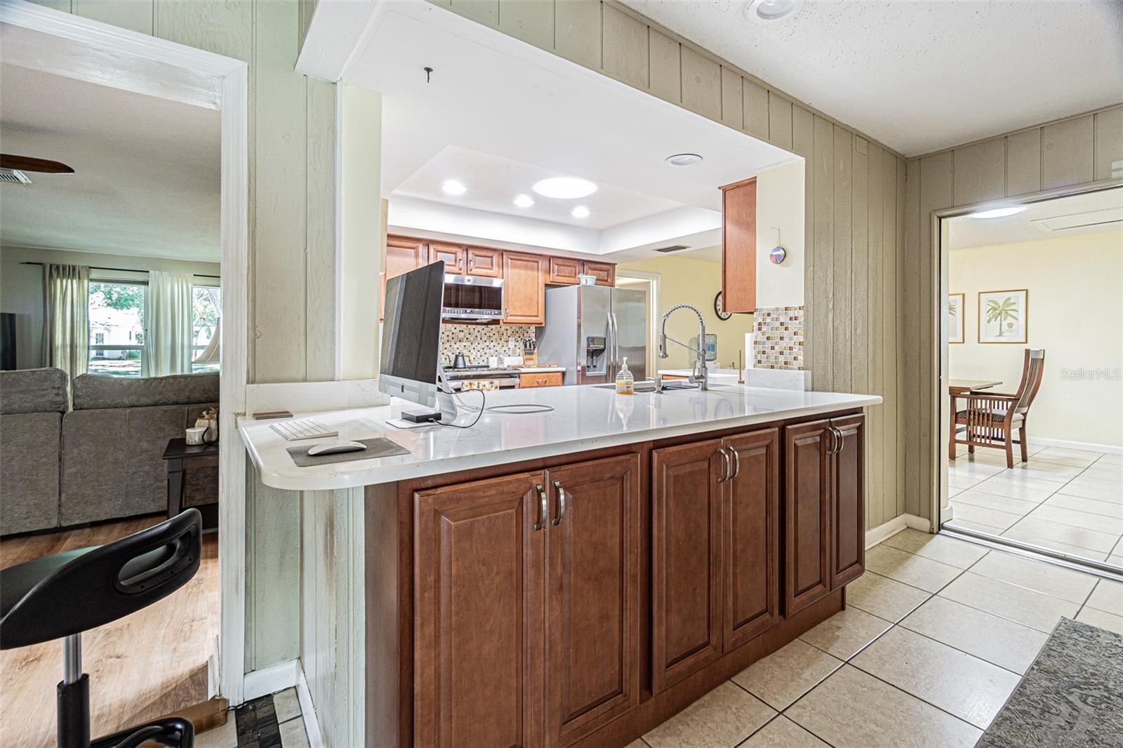 Huge island and extra cabinet storage between the kitchen and then bonus/flex space.