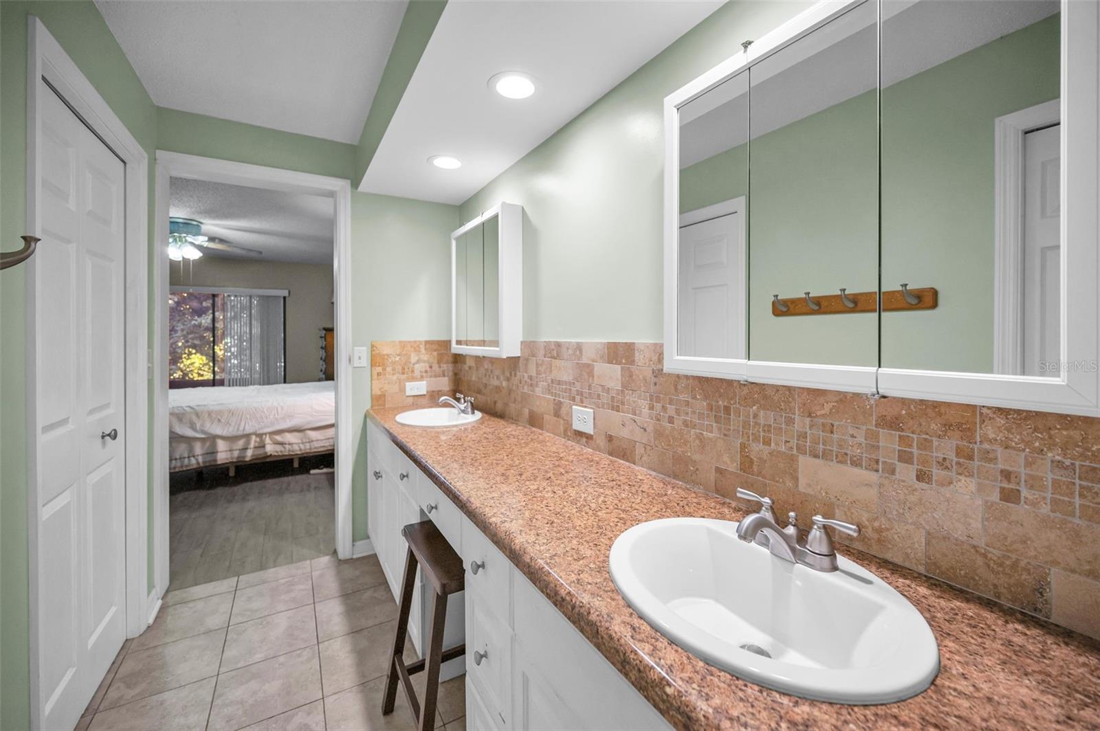 Primary bathroom with double sinks and mirrors