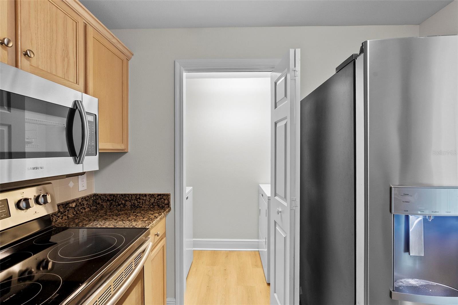 view to the laundry room with full size washer & dryer
