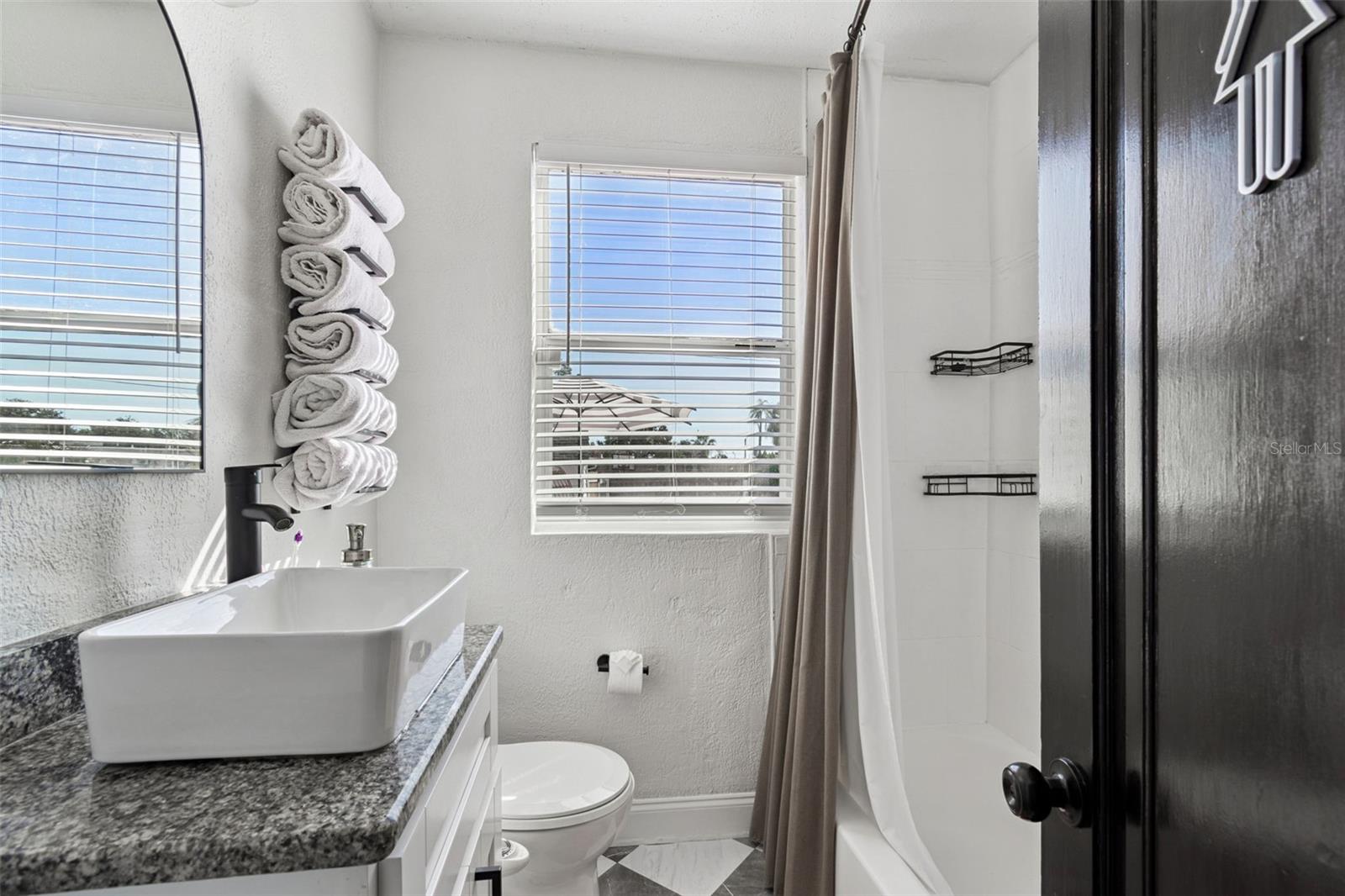 1st floor bathroom with tub and shower
