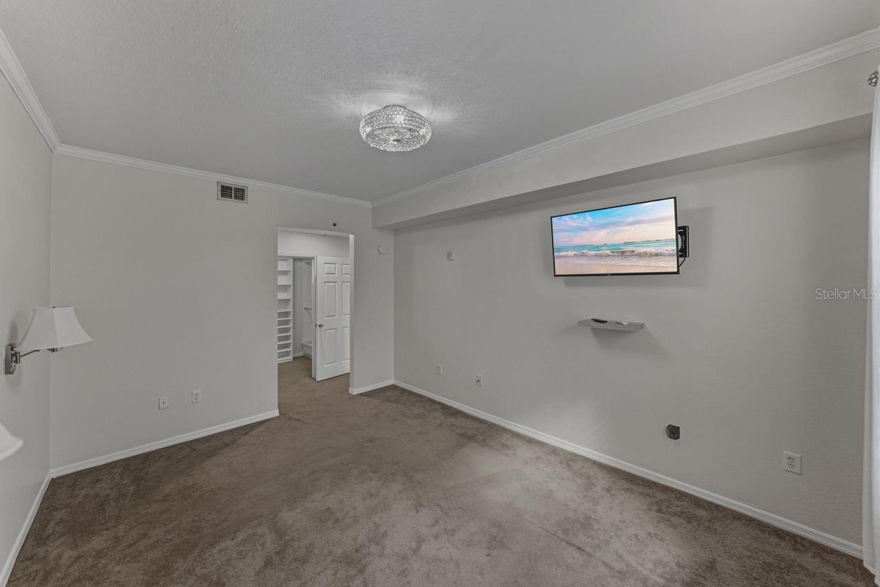 Primary bedroom with ensuite bathroom and large walkin closet.
