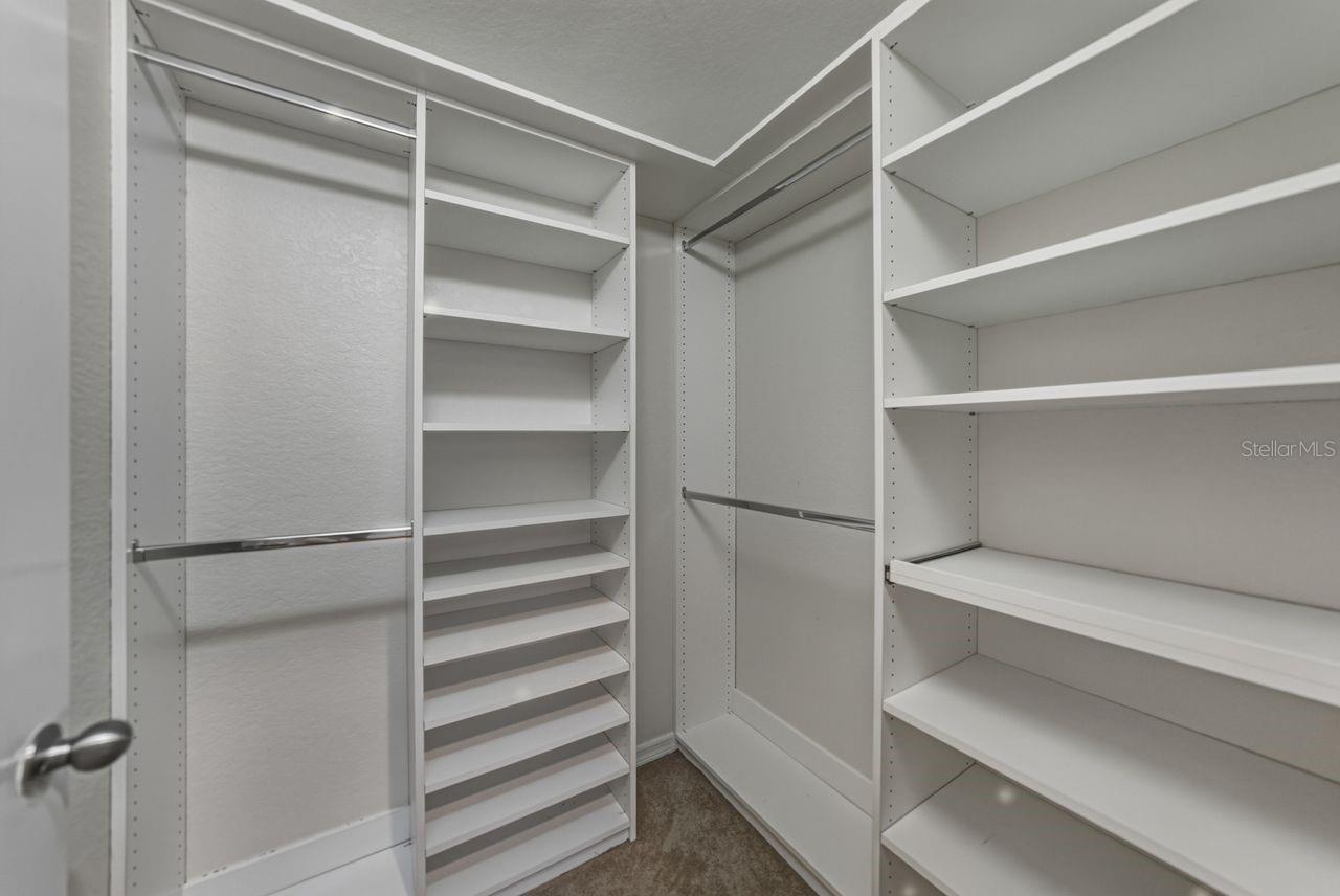 A custom closet offering plenty of storage space.