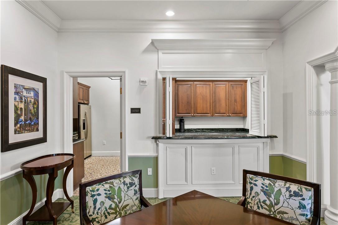 View into the catering kitchen from the middle portion of the social room