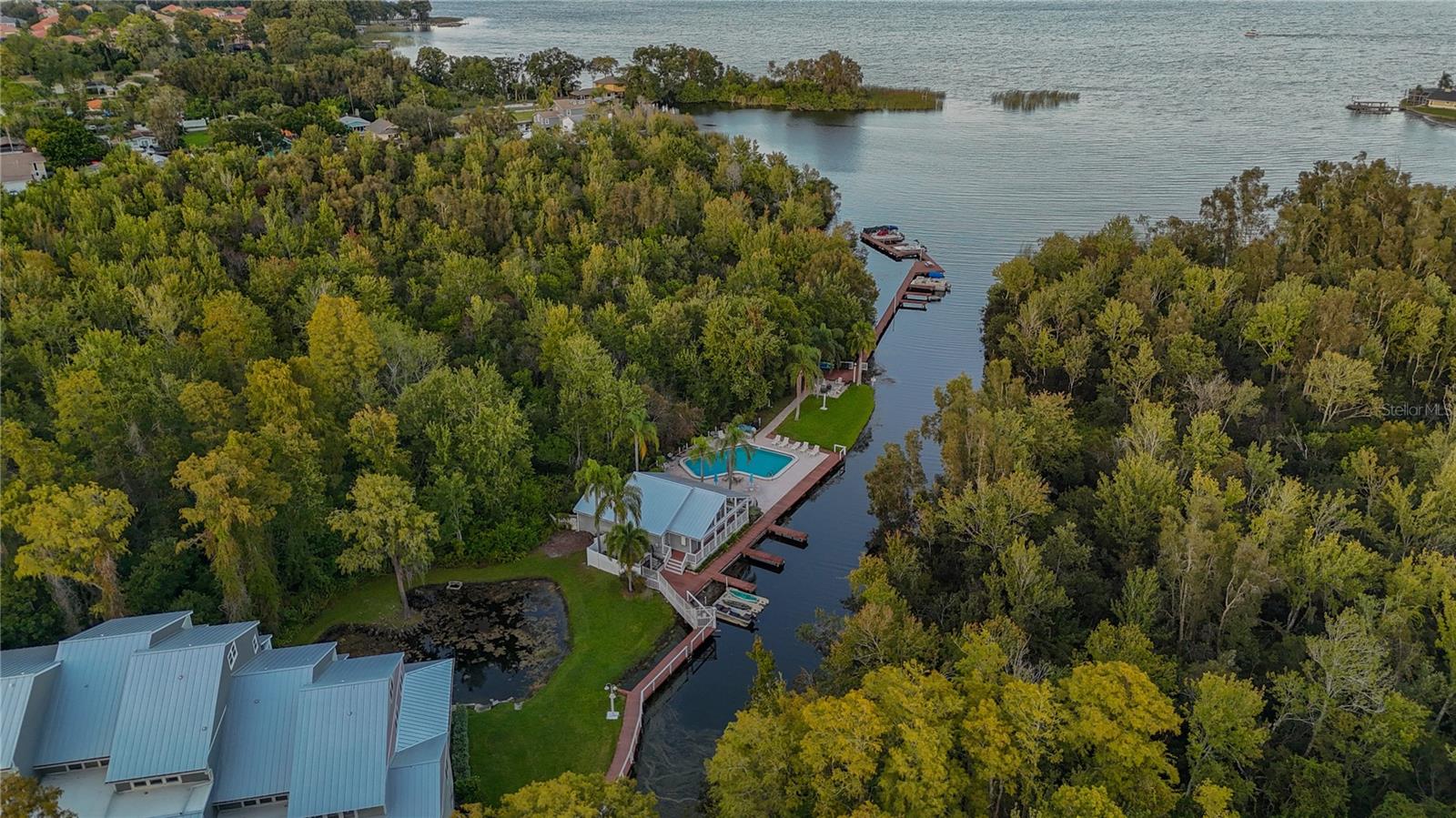 Arial of Pool, Clubhouse, Boat Slips, Firepit, Lake Tarpon!