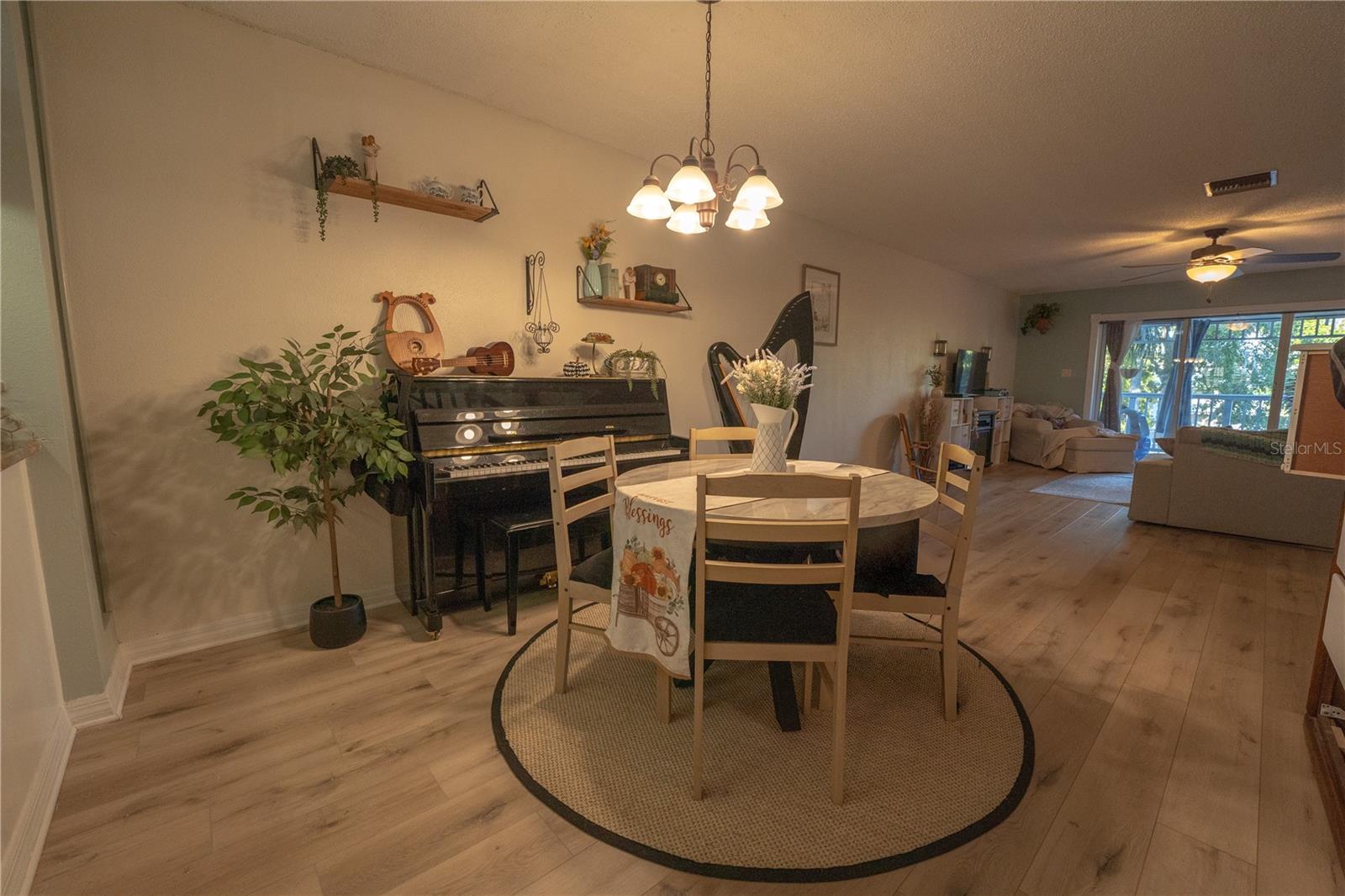 Dining Room with wet bar to the left.  Spacious living room to the lanai.